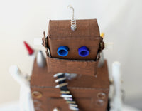 Handmade robot with old pen parts